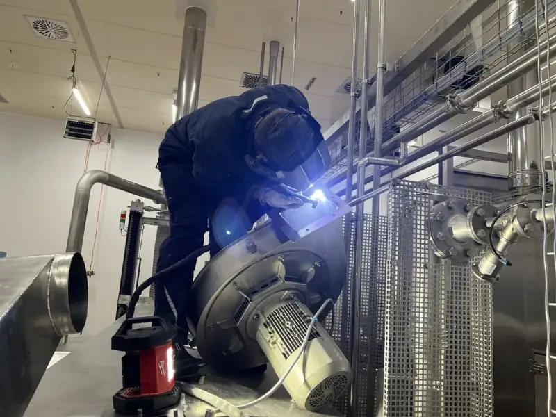 TIG welding on stainless steel pipe in industrial facility